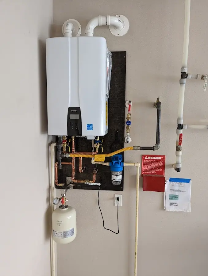 Professional plumber installing copper piping in a Gonzales home